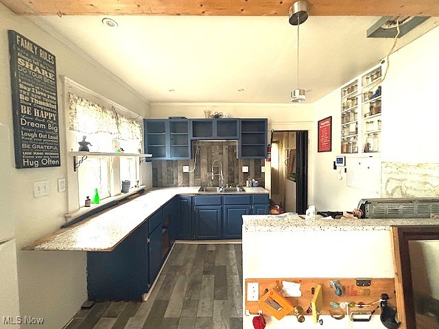 805 Rudyard Road Cleveland, OH 44110 - Photo 7 of 45 Kitchen featuring open shelves, dark wood-type flooring, blue cabinets, and tasteful backsplash