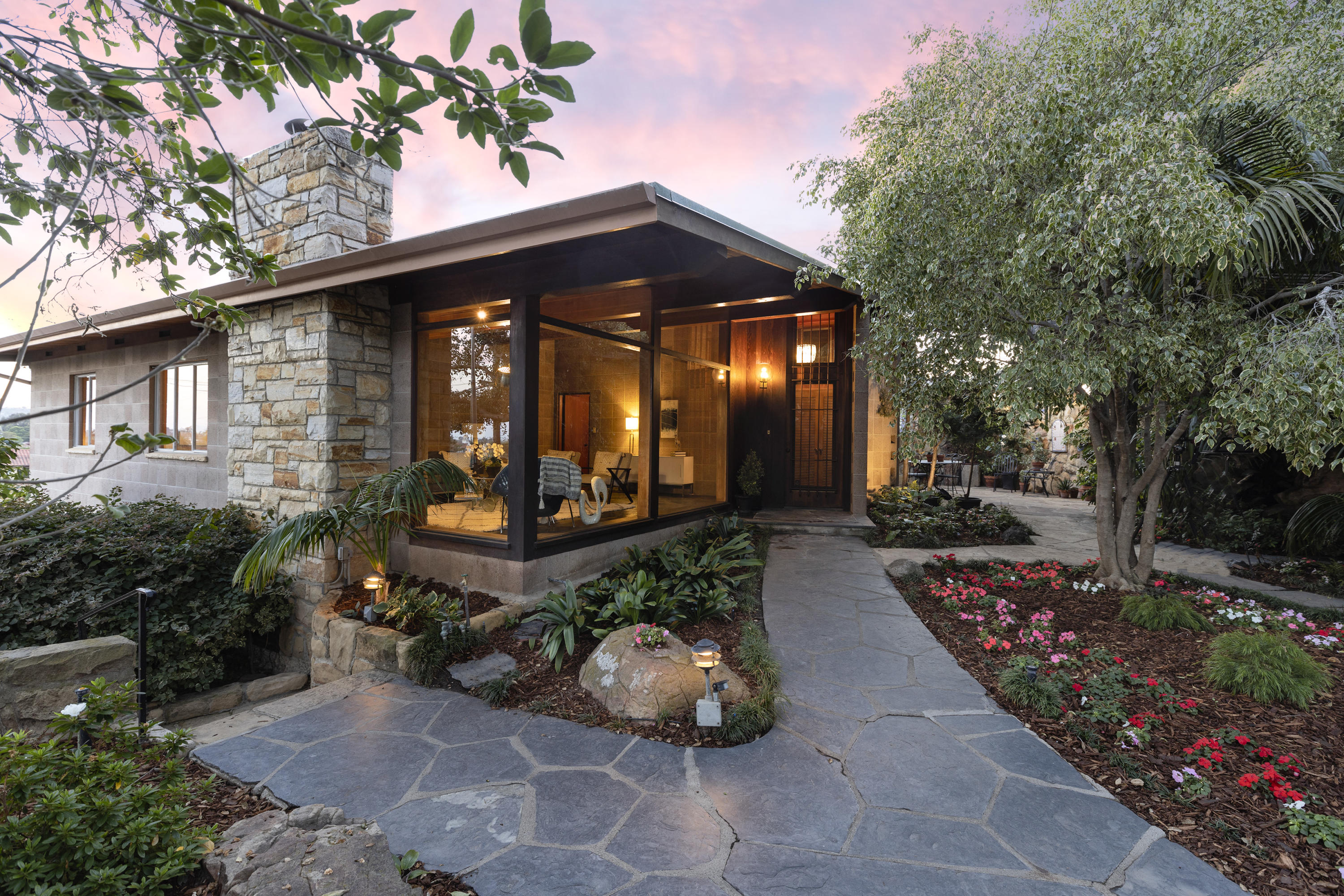 976 East Carrillo Road Santa Barbara, CA 93103 - Photo 1 of 22 a front view of a house with garden