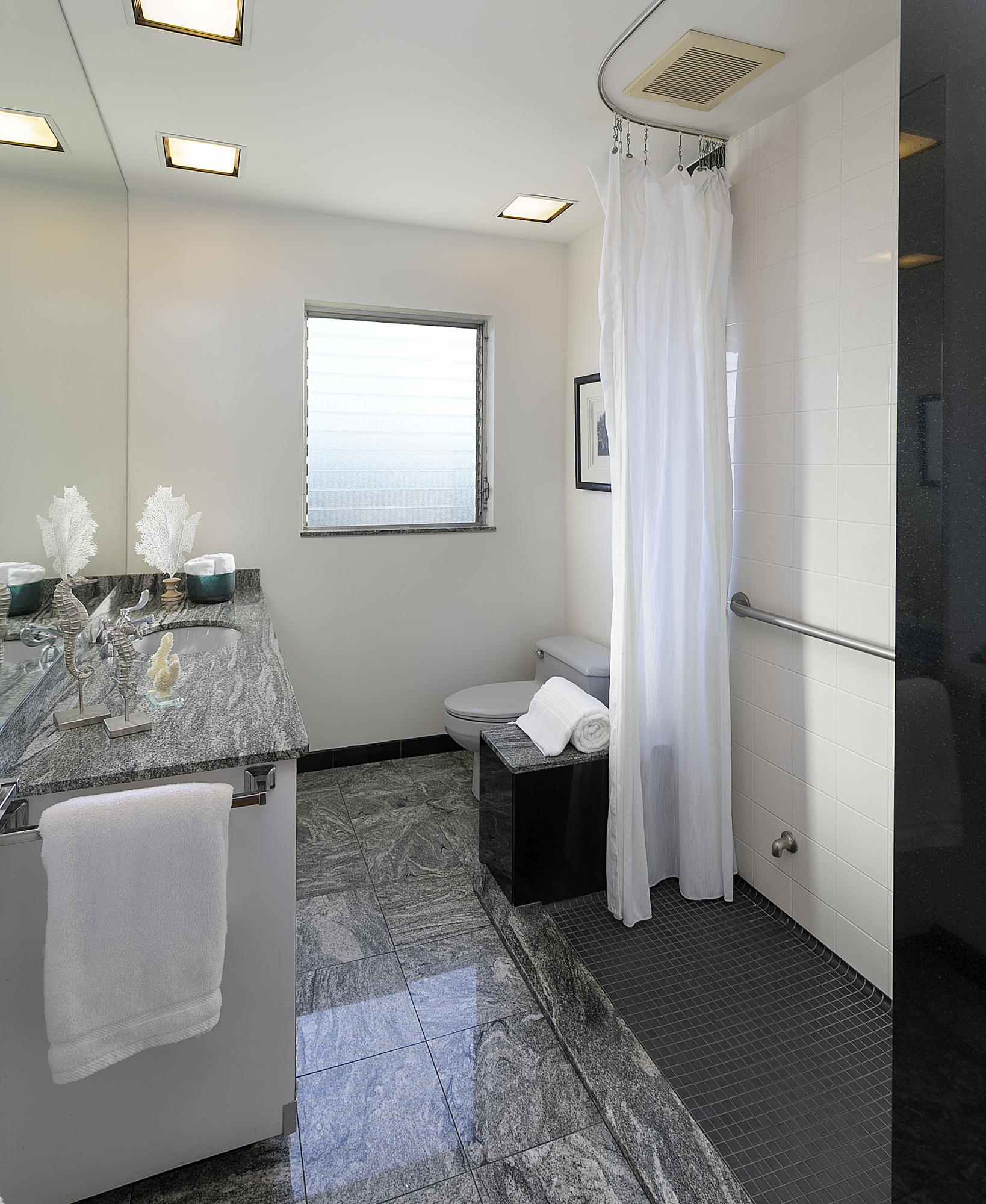 976 East Carrillo Road Santa Barbara, CA 93103 - Photo 13 of 22 a bathroom with a granite countertop sink and a mirror