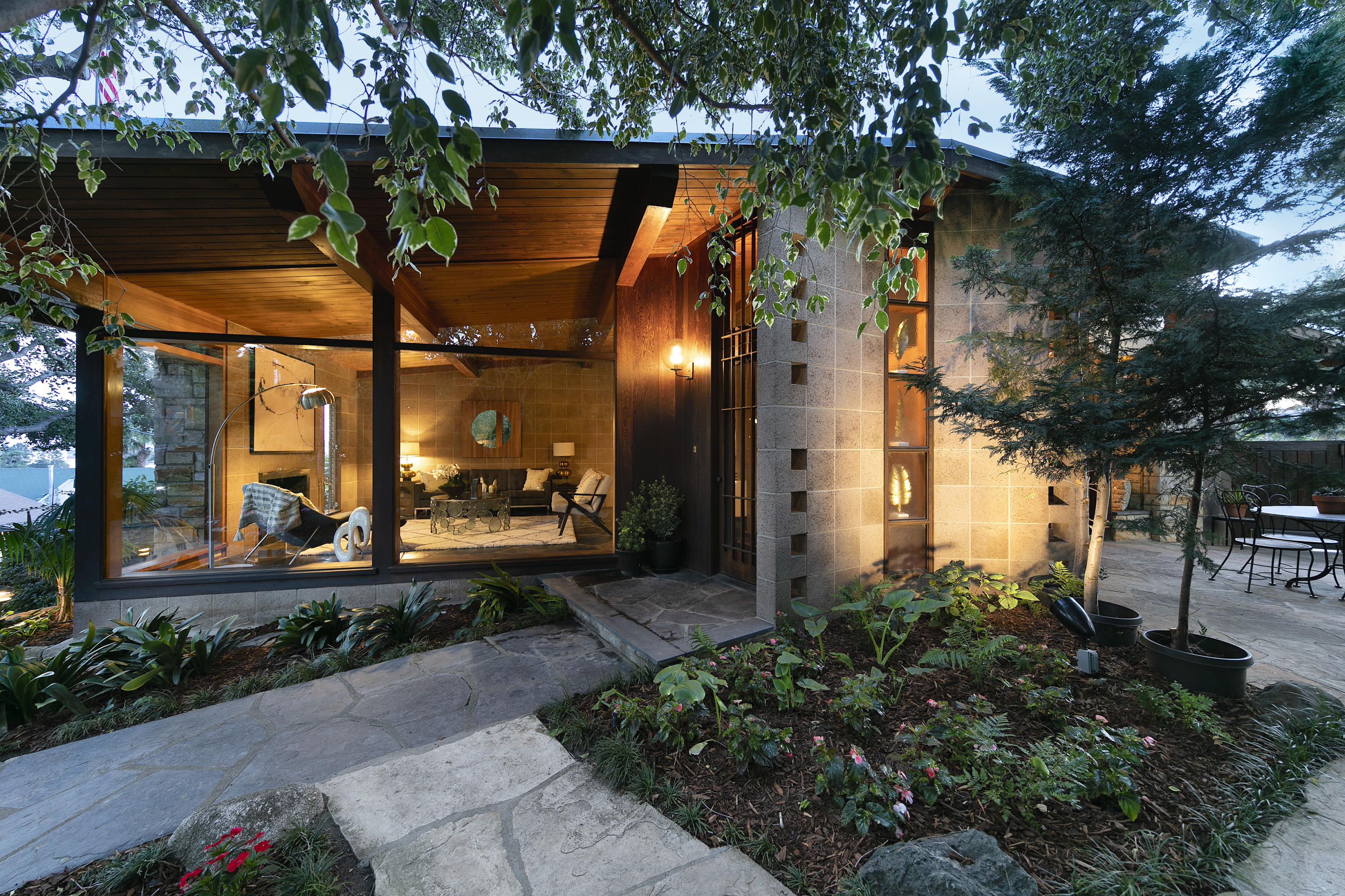 976 East Carrillo Road Santa Barbara, CA 93103 - Photo 2 of 22 a front view of a house with a yard and potted plants