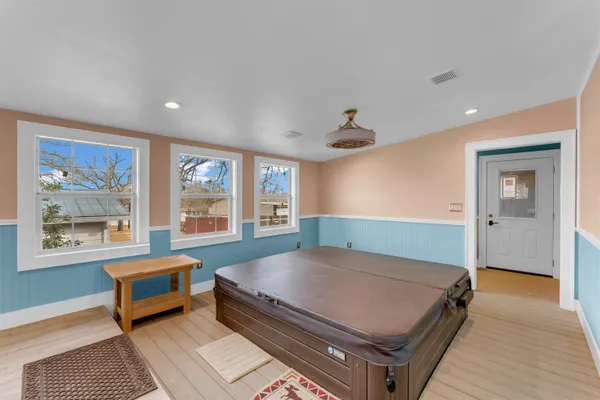 a bed room with a bed and a window