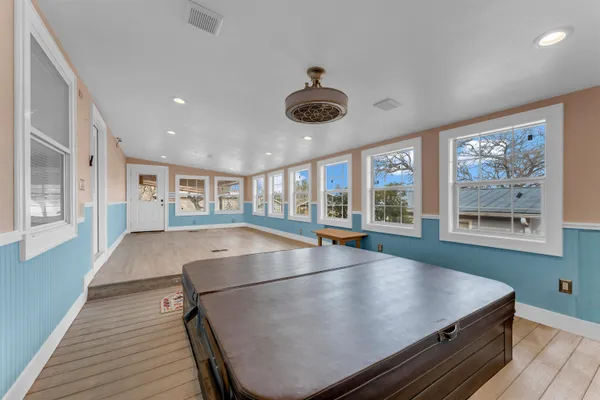 a room with stainless steel appliances lots of counter space and a window