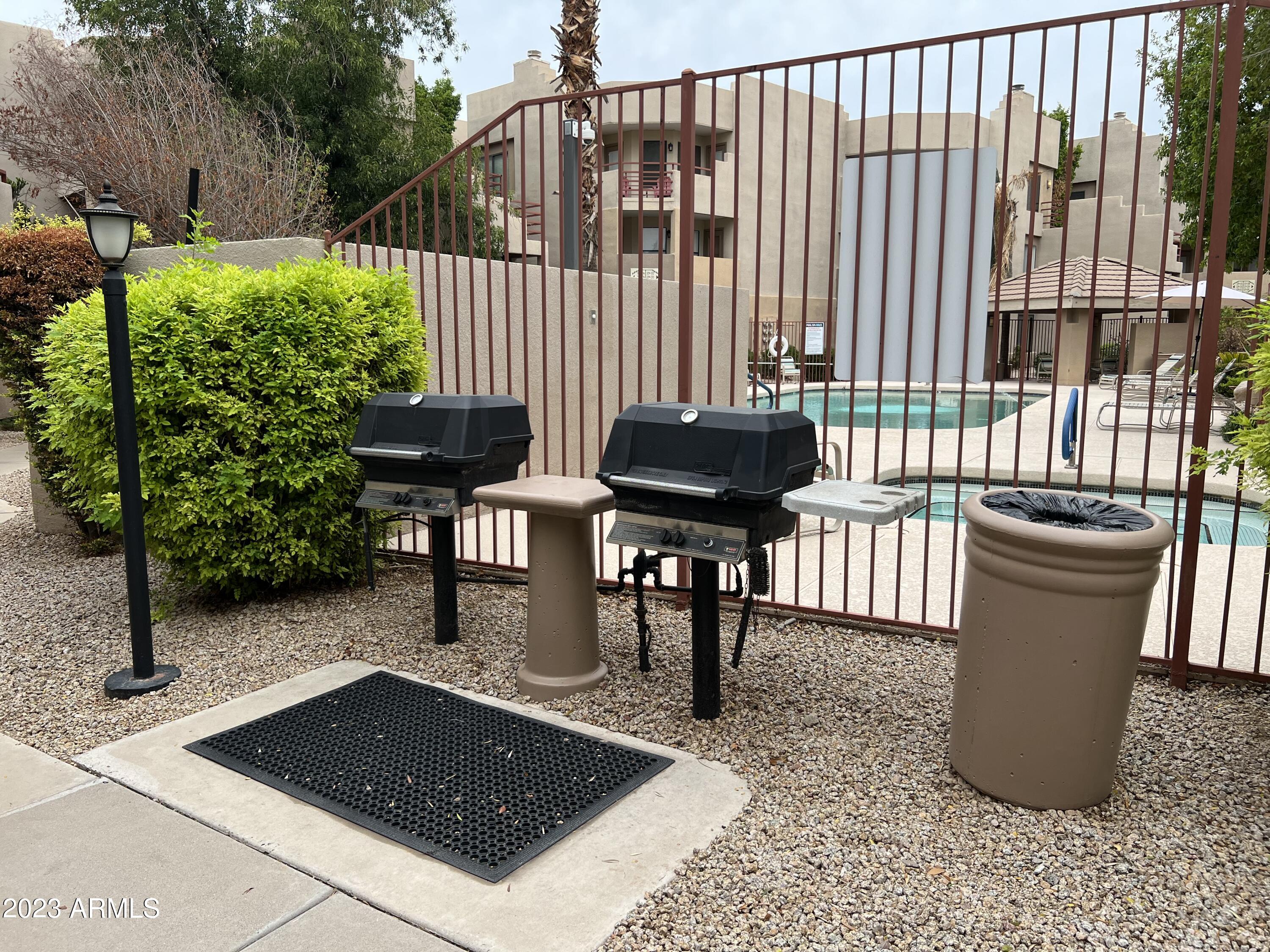 4850 East Desert Cove Avenue, Unit 105 Scottsdale, AZ 85254 - Photo 12 of 12 a view of a two chairs in the patio