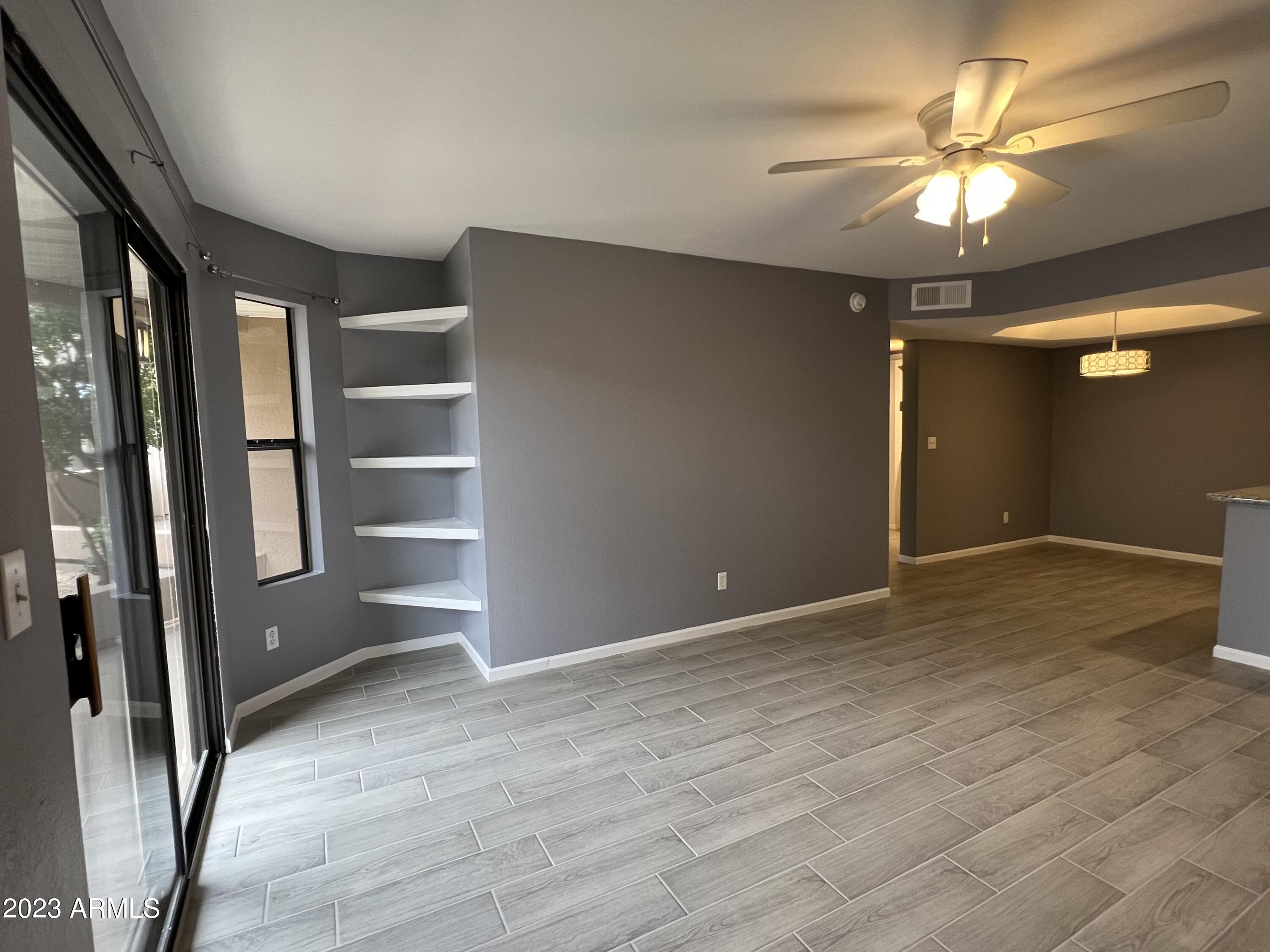 4850 East Desert Cove Avenue, Unit 105 Scottsdale, AZ 85254 - Photo 5 of 12 a view of an empty room with a window