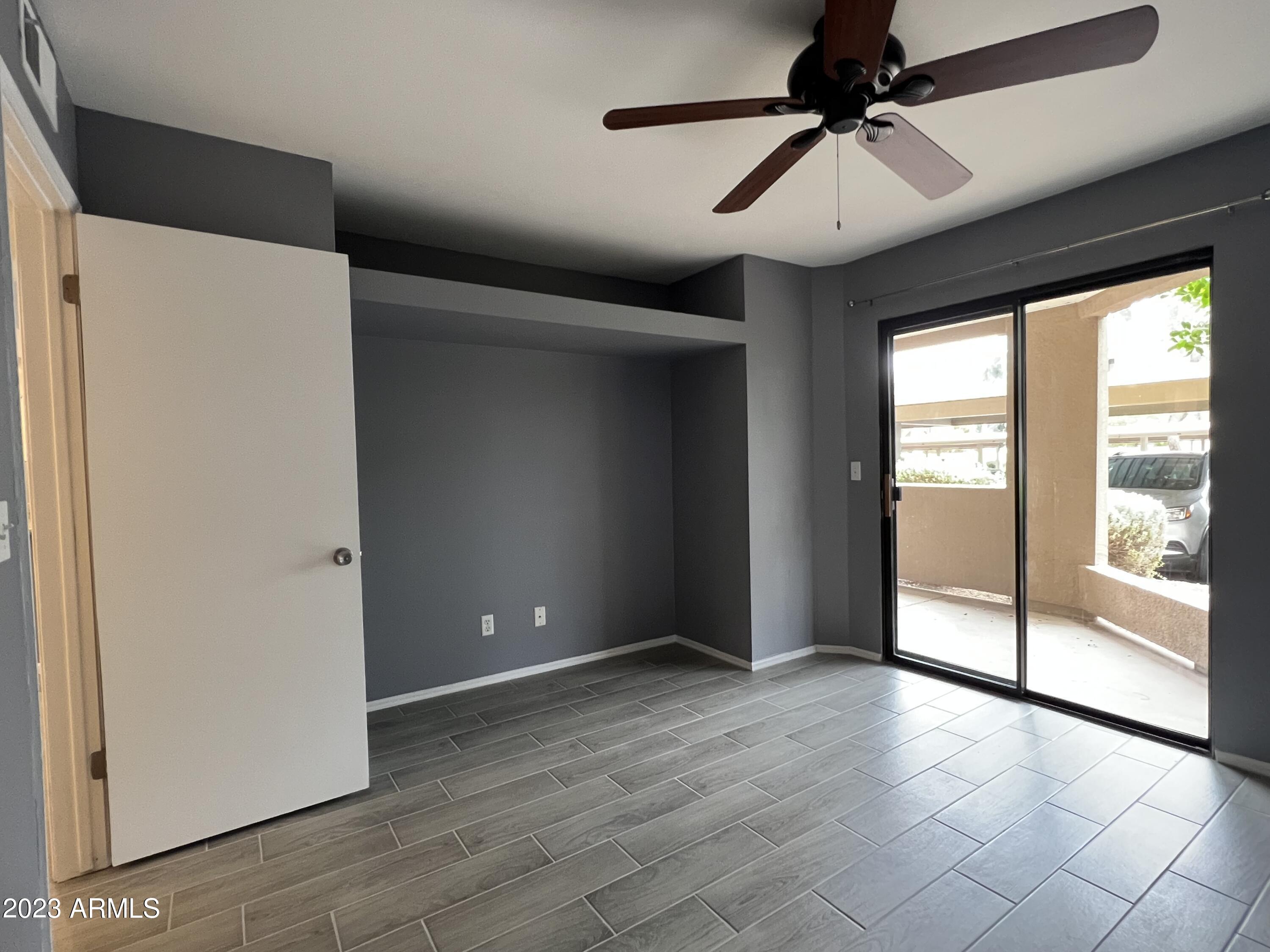 4850 East Desert Cove Avenue, Unit 105 Scottsdale, AZ 85254 - Photo 7 of 12 a view of an empty room with a window