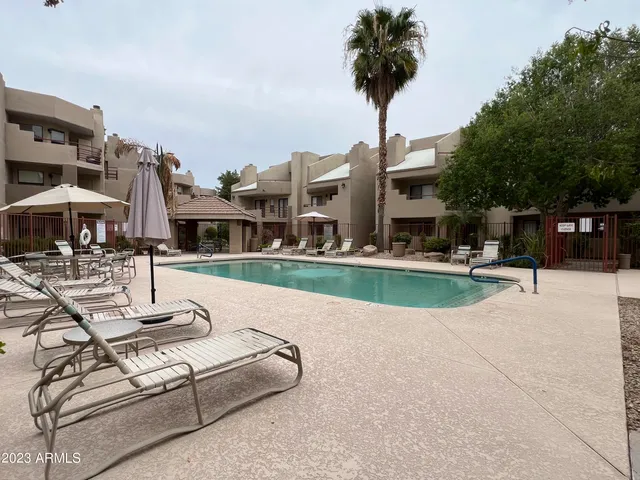 a view of multiple house with swimming pool