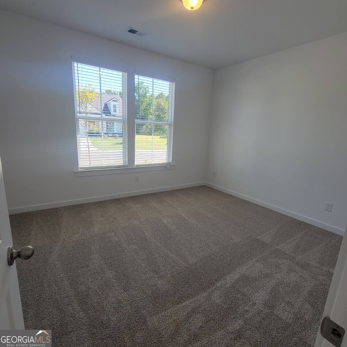 107 Breakwater Way Perry, GA 31069 - Photo 14 of 31 an empty room with a window