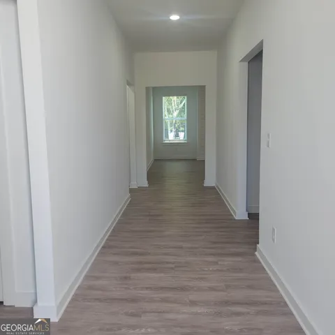 a view of entryway with wooden floor