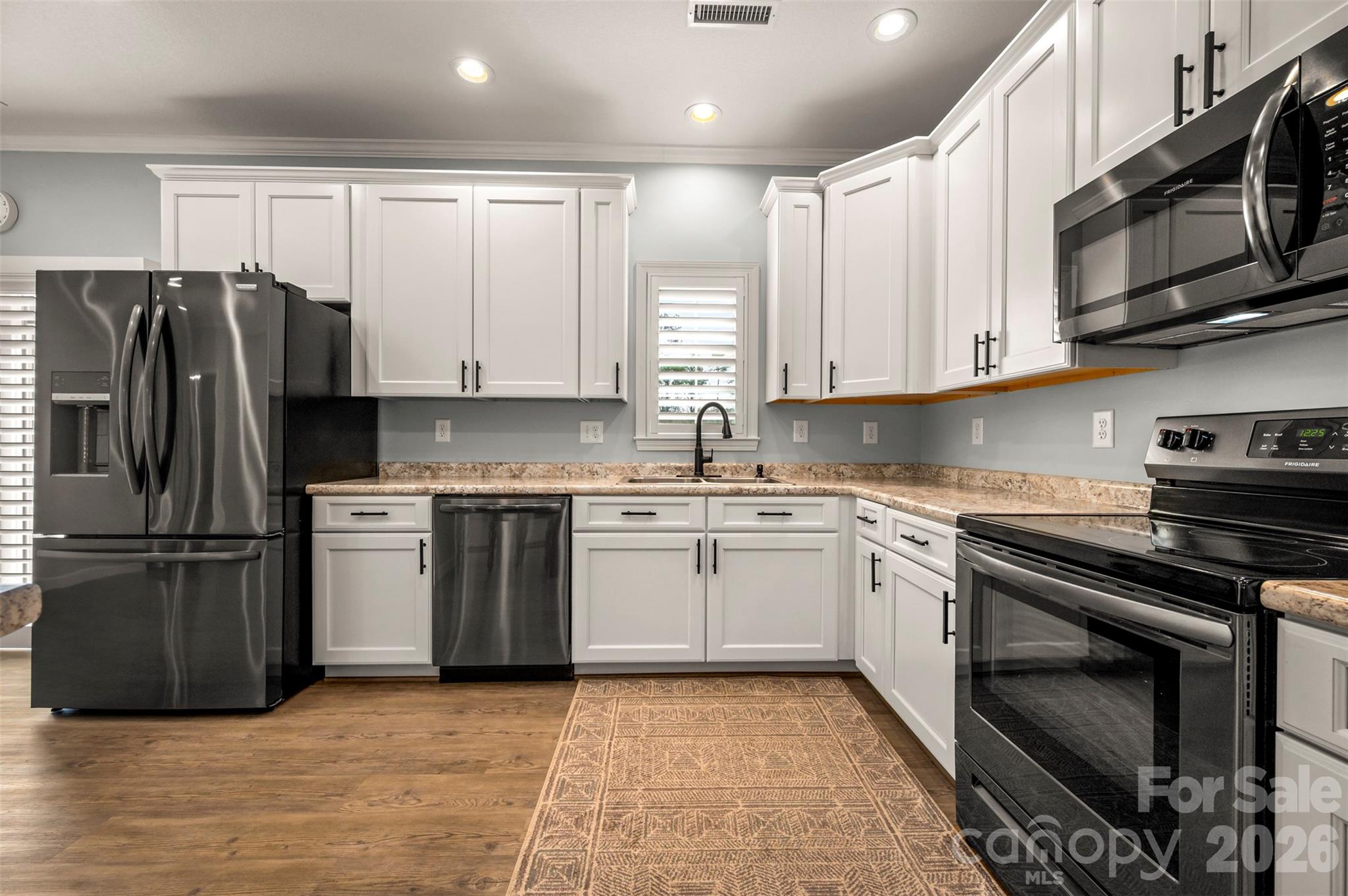 168 Nursery Road Forest City, NC 28043 - Photo 13 of 30 a kitchen with stainless steel appliances granite countertop a stove a refrigerator and a microwave