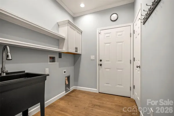 a view of a utility room with closet