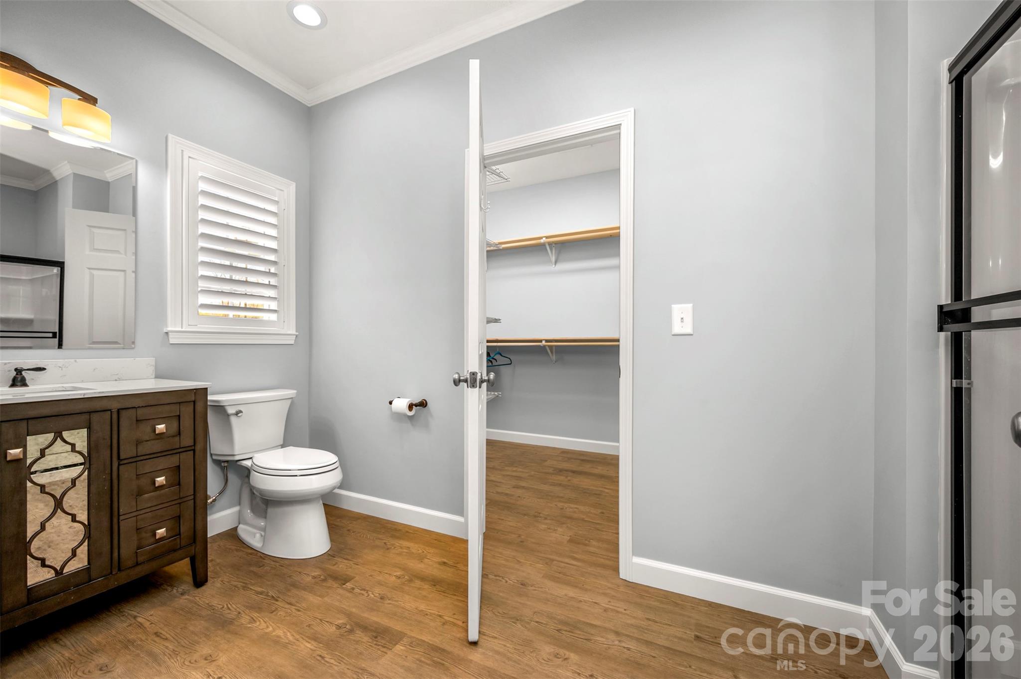 168 Nursery Road Forest City, NC 28043 - Photo 19 of 30 a bathroom with a toilet sink and a mirror