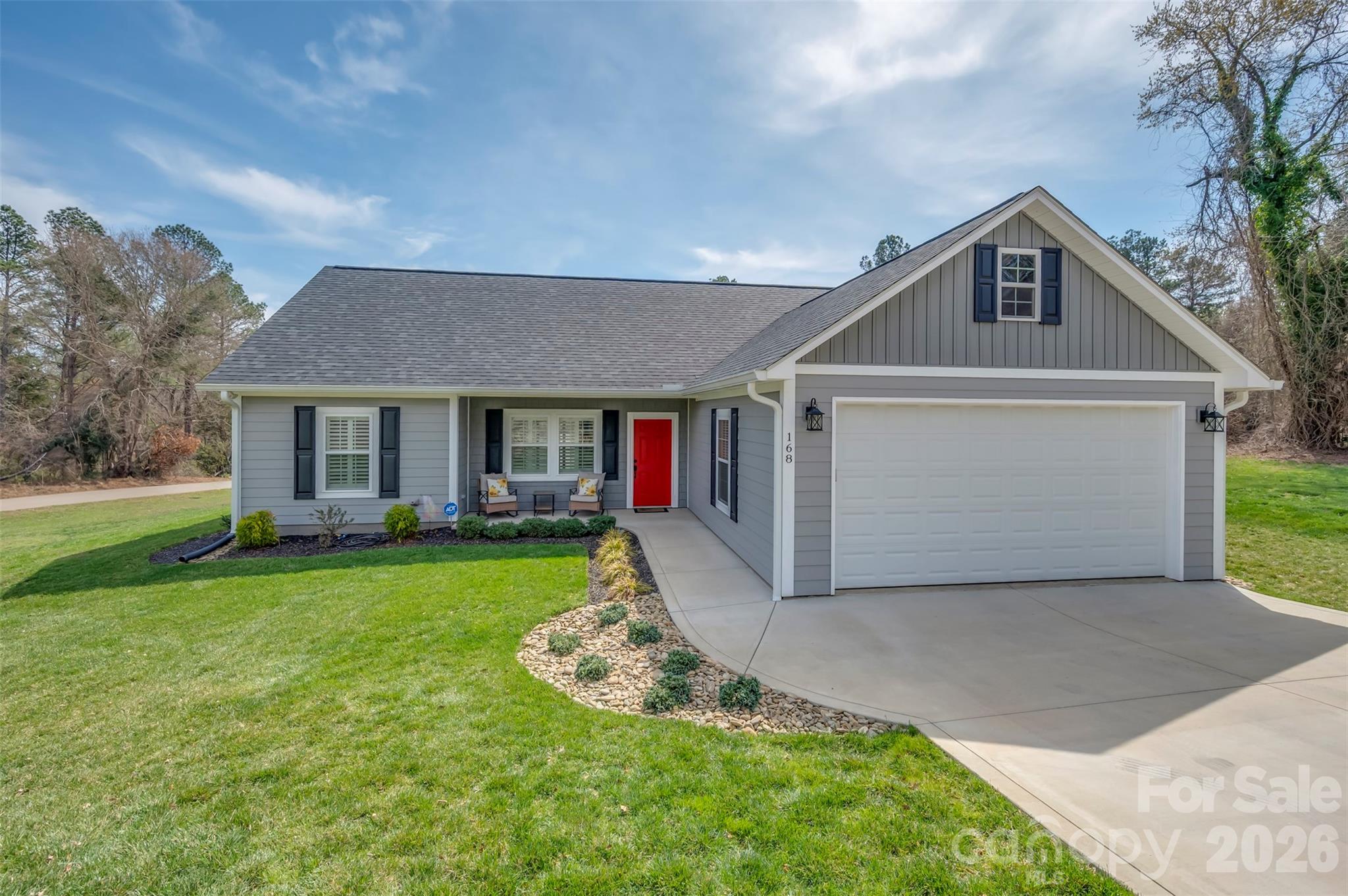 168 Nursery Road Forest City, NC 28043 - Photo 4 of 30 a front view of a house with a yard and garage