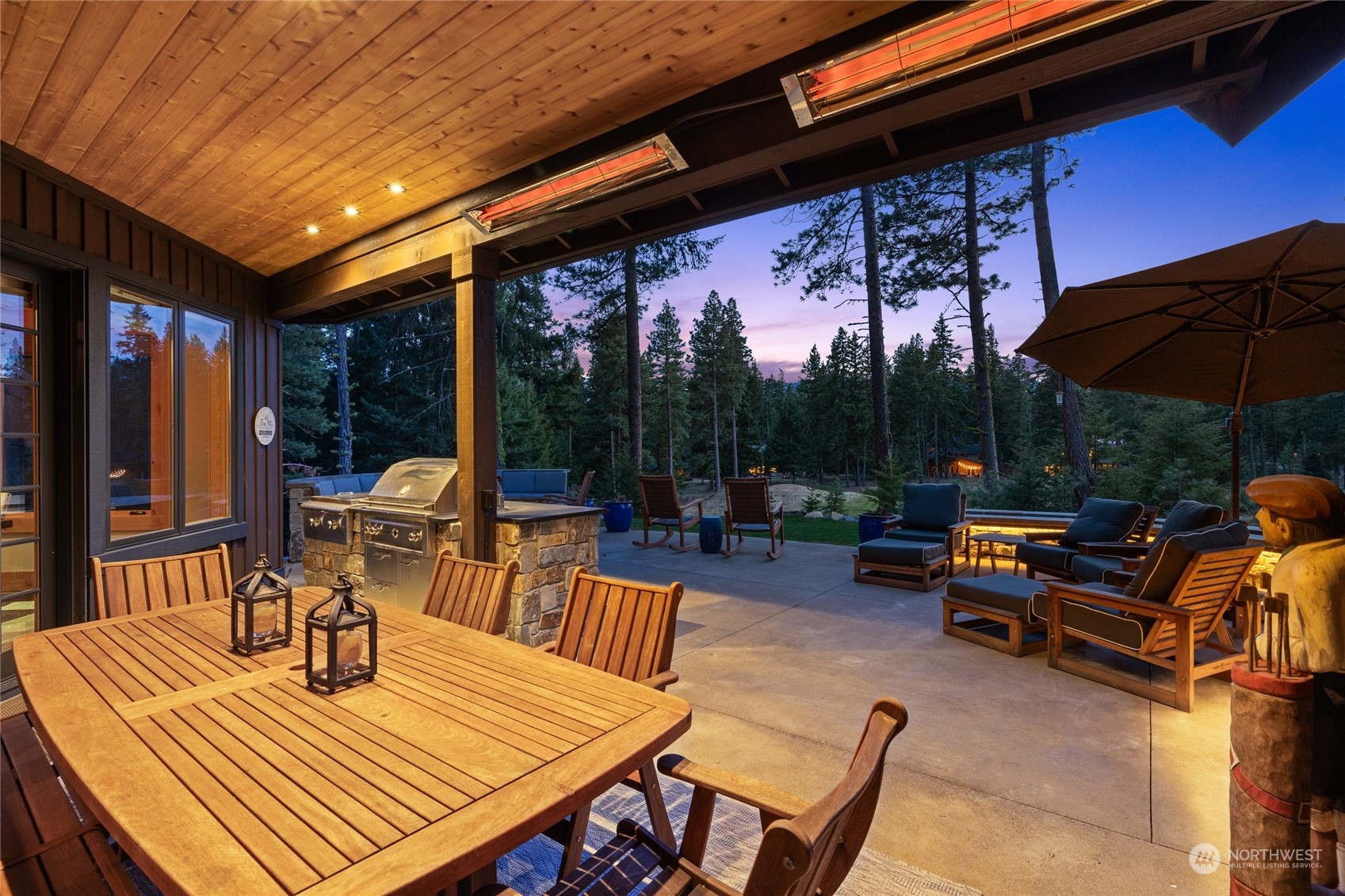 1491 Larkspur Loop Cle Elum, WA 98922 - Photo 14 of 40 a view of a patio with a dining table and chairs