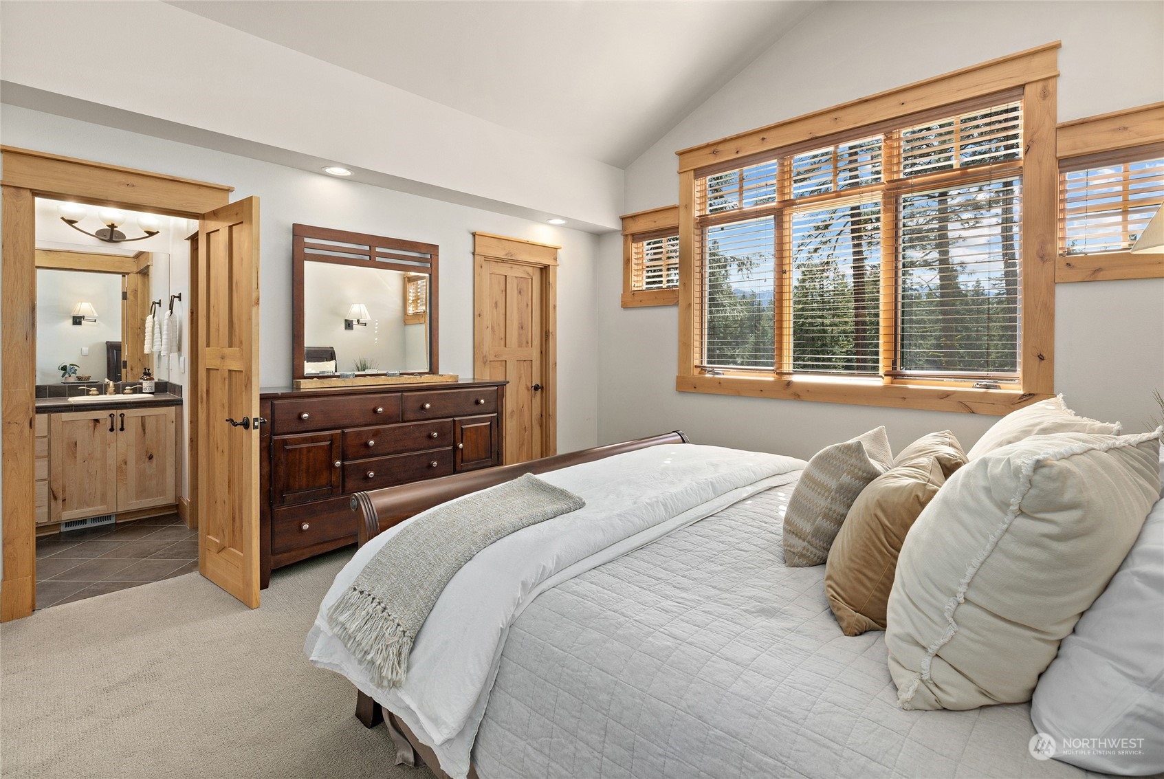 1491 Larkspur Loop Cle Elum, WA 98922 - Photo 29 of 40 a bedroom with a bed and dresser with mirror