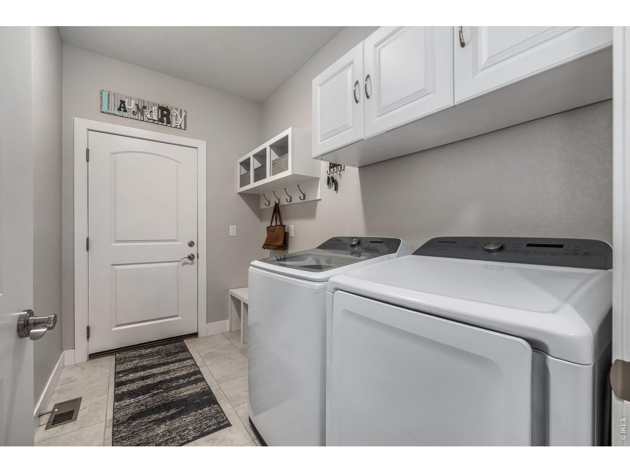 3789 Bridle Ridge Circle Severance, CO 80524 - Photo 32 of 44 a utility room with dryer and washer