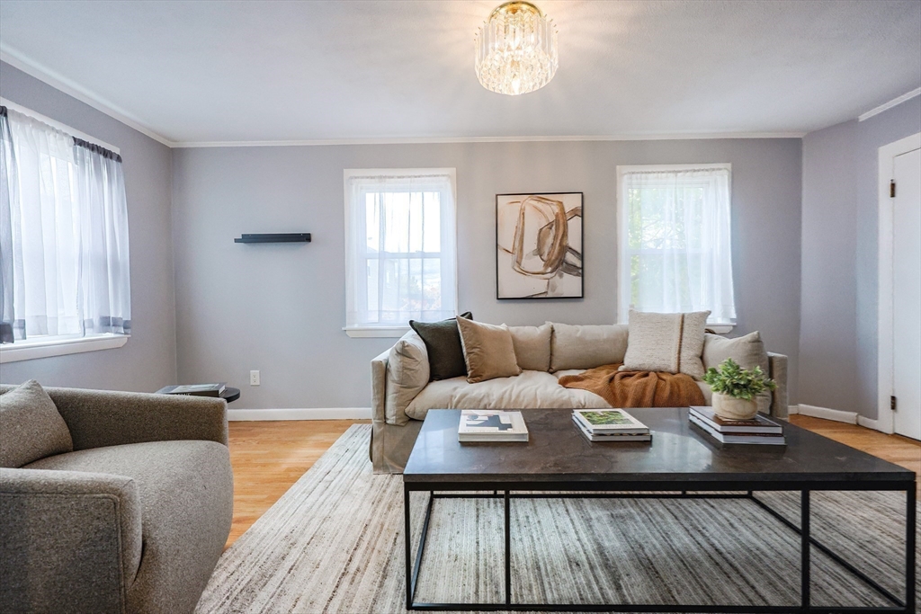 3 Vinal Street Somerville, MA 02145 - Photo 11 of 29 a living room with furniture and wooden floor