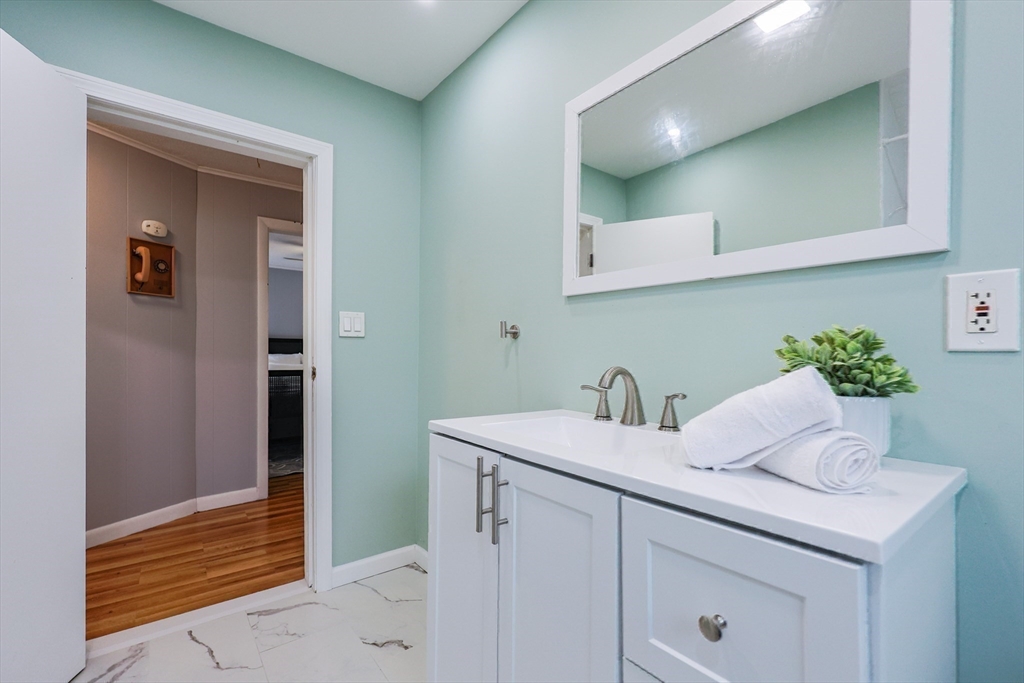 3 Vinal Street Somerville, MA 02145 - Photo 13 of 29 a bathroom with a sink and a mirror