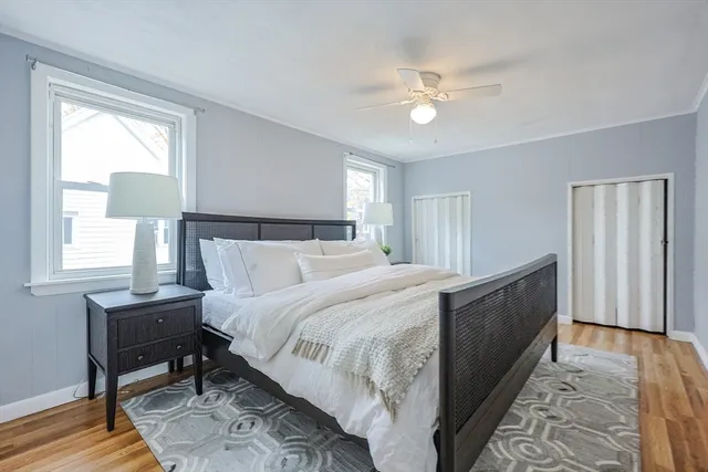 a bed room with a bed and a chandelier