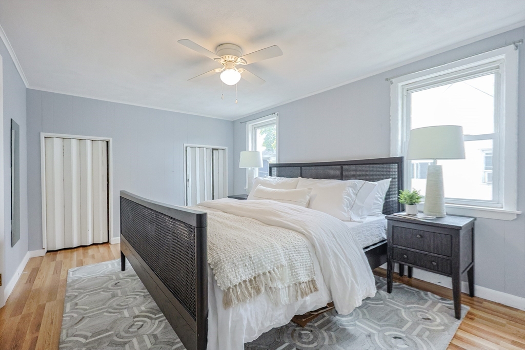3 Vinal Street Somerville, MA 02145 - Photo 15 of 29 a bedroom with a bed and a chandelier