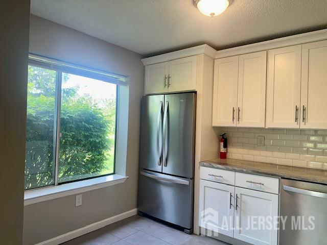 3 Farnham Square Parlin, NJ 08859 - Photo 13 of 31 a kitchen with a refrigerator and window