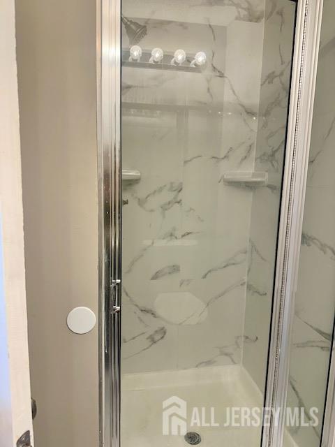 3 Farnham Square Parlin, NJ 08859 - Photo 30 of 31 a bathroom with a glass shower door