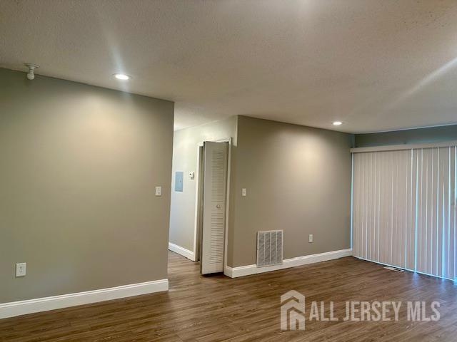 3 Farnham Square Parlin, NJ 08859 - Photo 6 of 31 an empty room with wooden floor and windows