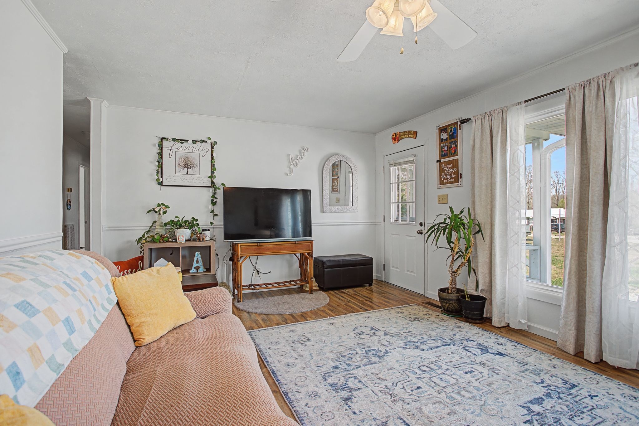 127 Rockhouse Road Hohenwald, TN 38462 - Photo 11 of 28 a living room with furniture and a flat screen tv