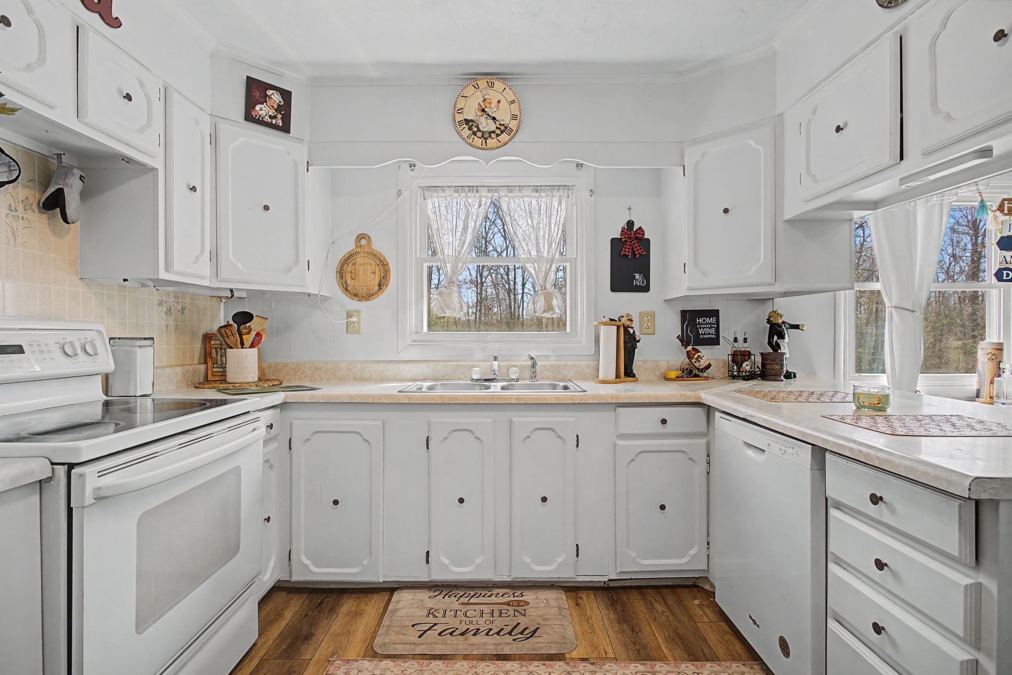 127 Rockhouse Road Hohenwald, TN 38462 - Photo 15 of 28 a kitchen with cabinets appliances and a window
