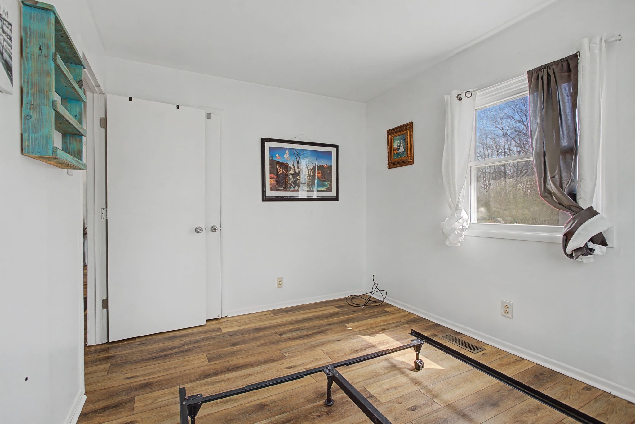 127 Rockhouse Road Hohenwald, TN 38462 - Photo 18 of 28 a view of a room with wooden floor and hallway