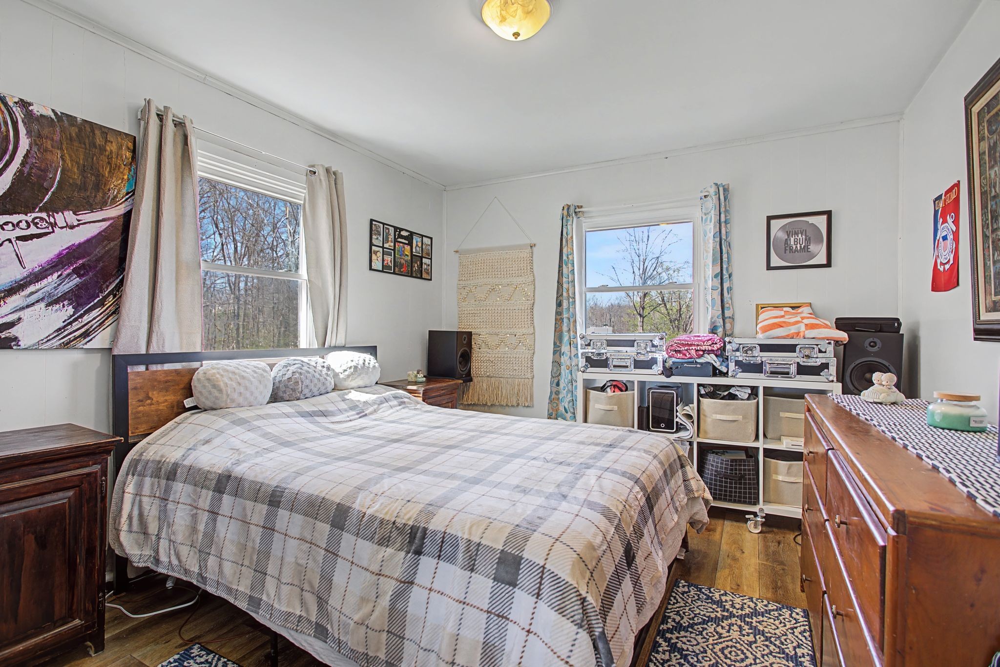 127 Rockhouse Road Hohenwald, TN 38462 - Photo 19 of 28 a bedroom with a bed and a dresser