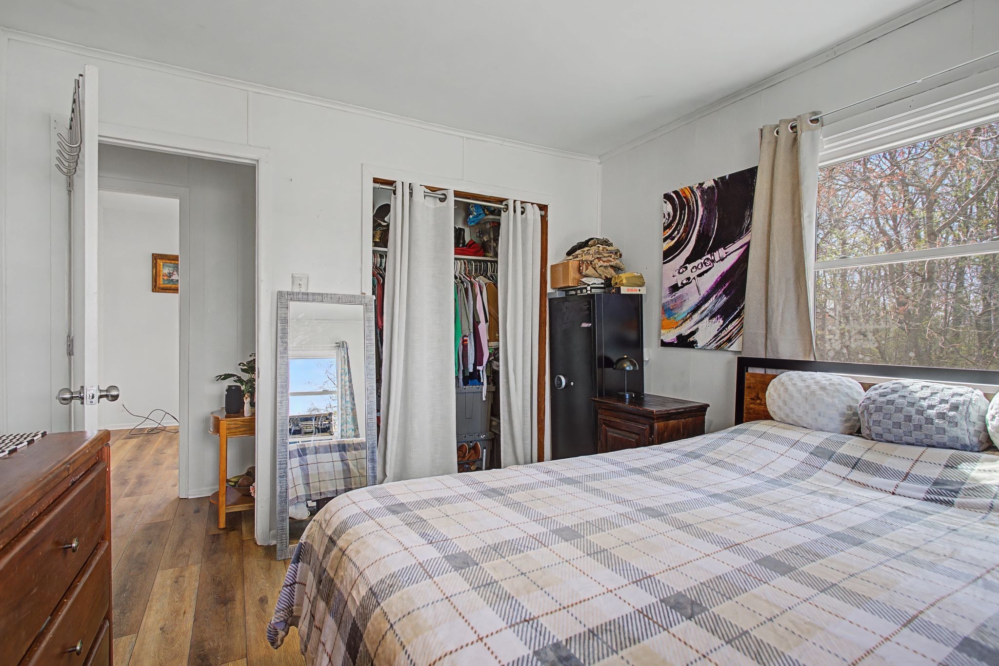 127 Rockhouse Road Hohenwald, TN 38462 - Photo 20 of 28 a bedroom with a large bed and a closet