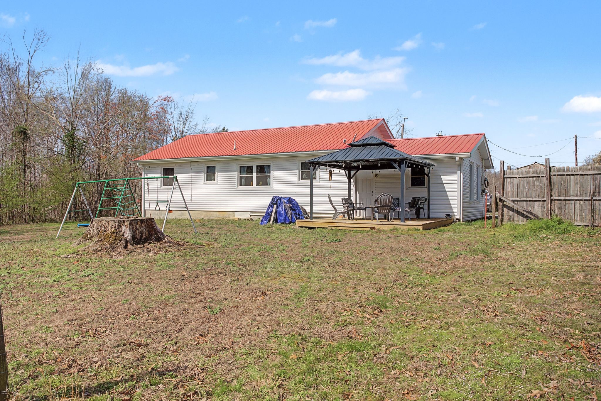 127 Rockhouse Road Hohenwald, TN 38462 - Photo 26 of 28 a view of a house with a yard