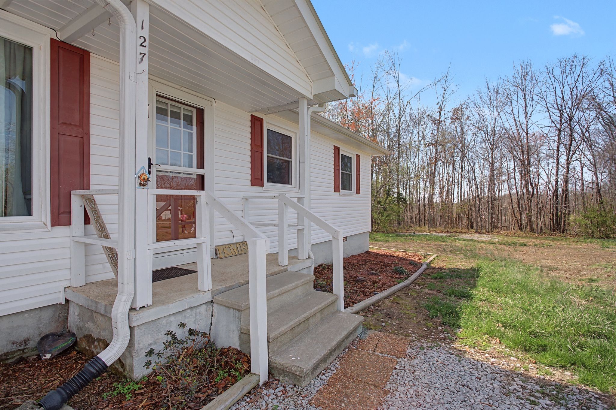 127 Rockhouse Road Hohenwald, TN 38462 - Photo 6 of 28 a backyard of a house with barbeque oven and outdoor seating
