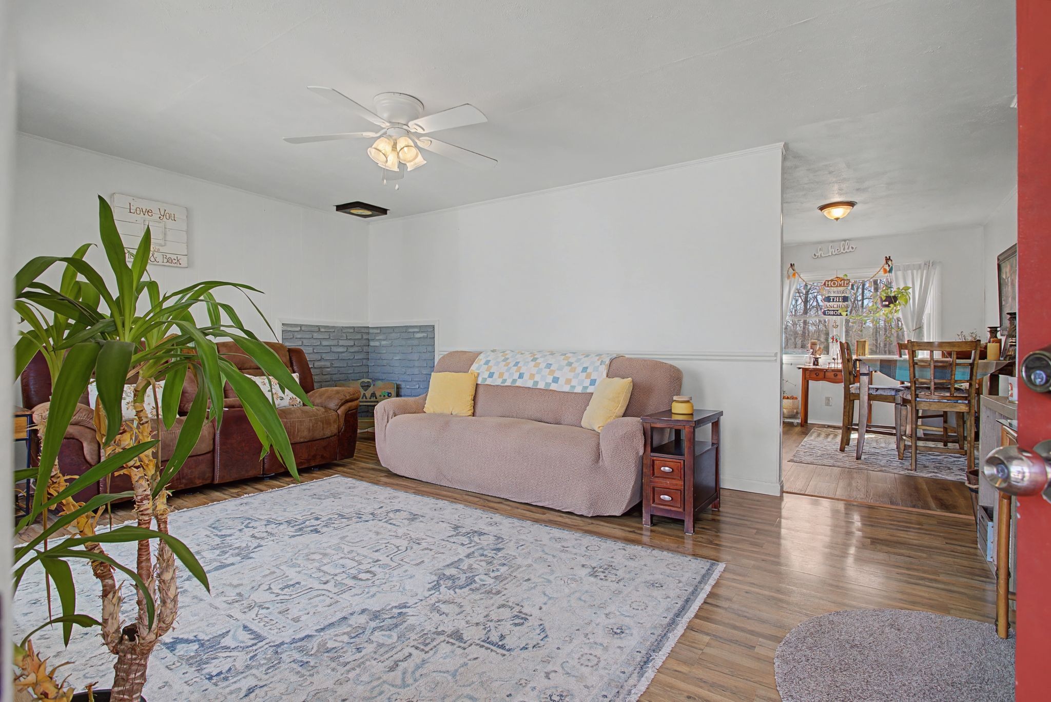 127 Rockhouse Road Hohenwald, TN 38462 - Photo 7 of 28 a living room with furniture and wooden floor