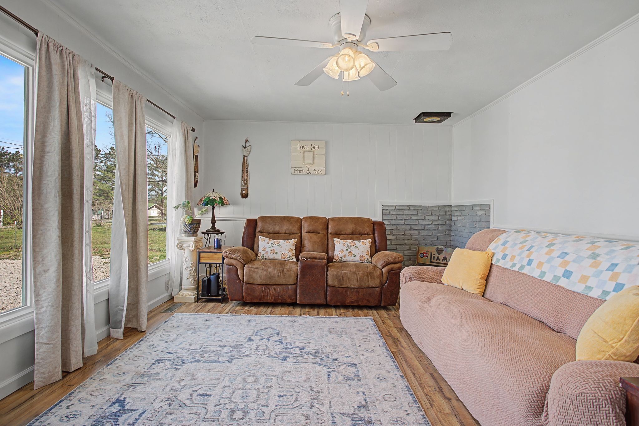 127 Rockhouse Road Hohenwald, TN 38462 - Photo 8 of 28 a living room with furniture and a chandelier