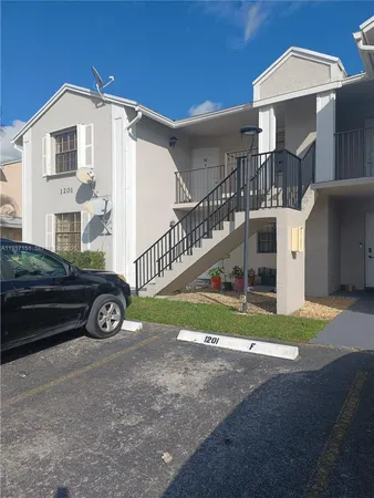 a view of a car in front of a house