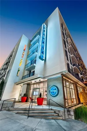 a living room with furniture fireplace and rug