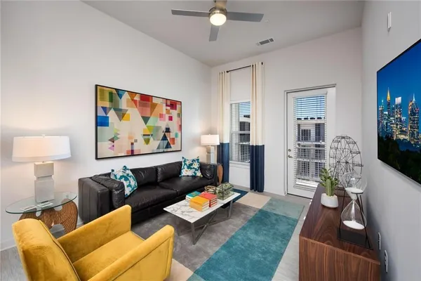 a view of a brick building next to a yard