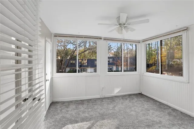 a view of an empty room with a window