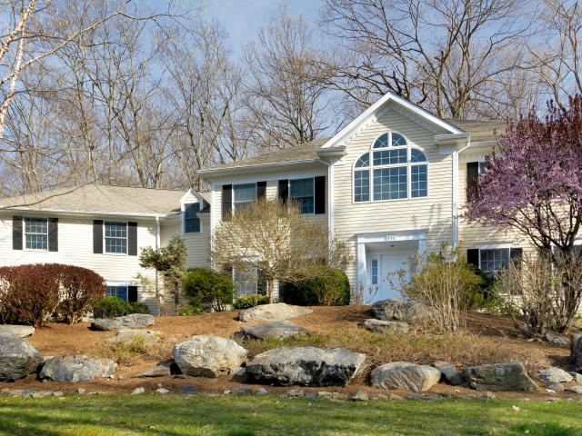 151 Ledges Road Ridgefield, CT 06877 - Photo 1 of 24 a front view of a house with a yard