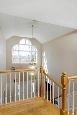 151 Ledges Road Ridgefield, CT 06877 - Photo 11 of 24 a view of an empty room with wooden floor and a window