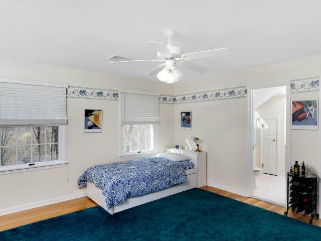151 Ledges Road Ridgefield, CT 06877 - Photo 16 of 24 a bedroom with a bed and a window with the outer view