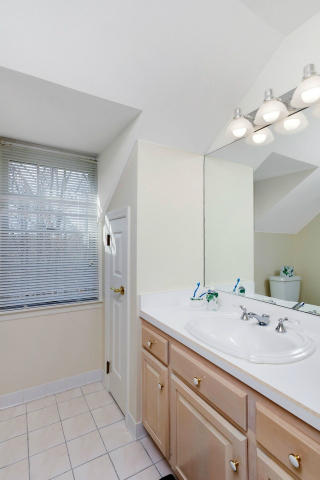 151 Ledges Road Ridgefield, CT 06877 - Photo 17 of 24 a bathroom with a double vanity sink and a mirror