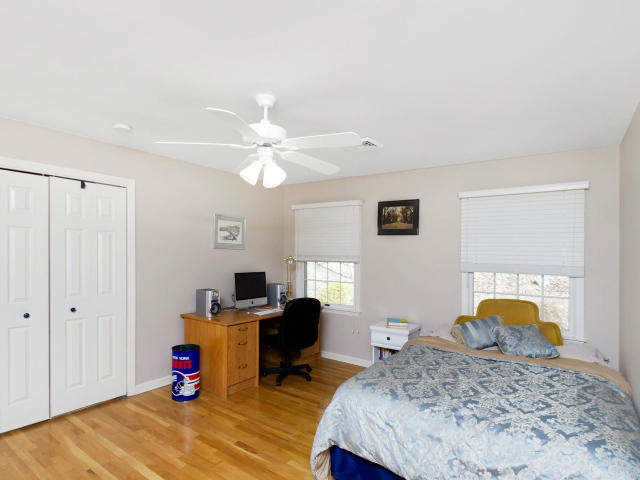 151 Ledges Road Ridgefield, CT 06877 - Photo 18 of 24 a bedroom with furniture and a chandelier