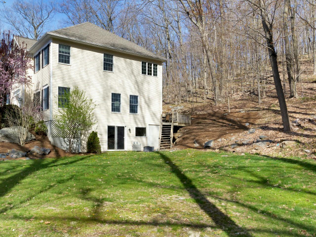 151 Ledges Road Ridgefield, CT 06877 - Photo 22 of 24 a front view of a house with a yard