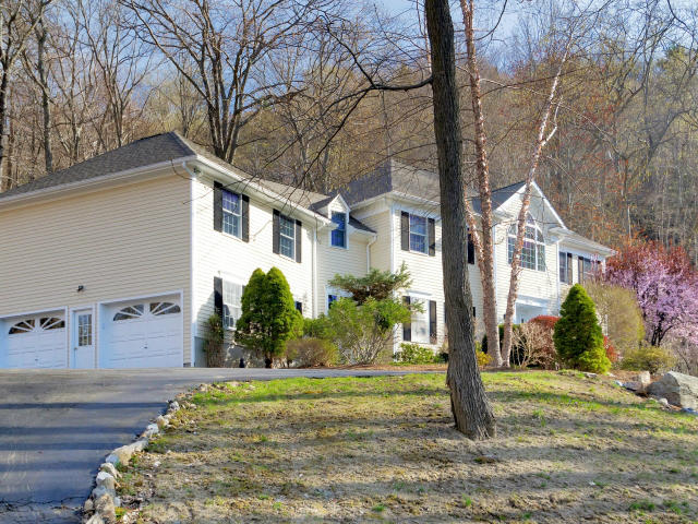 151 Ledges Road Ridgefield, CT 06877 - Photo 3 of 24 a front view of a house with a yard
