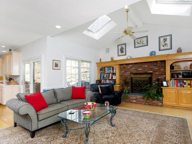 151 Ledges Road Ridgefield, CT 06877 - Photo 5 of 24 a living room with furniture a fireplace and a window