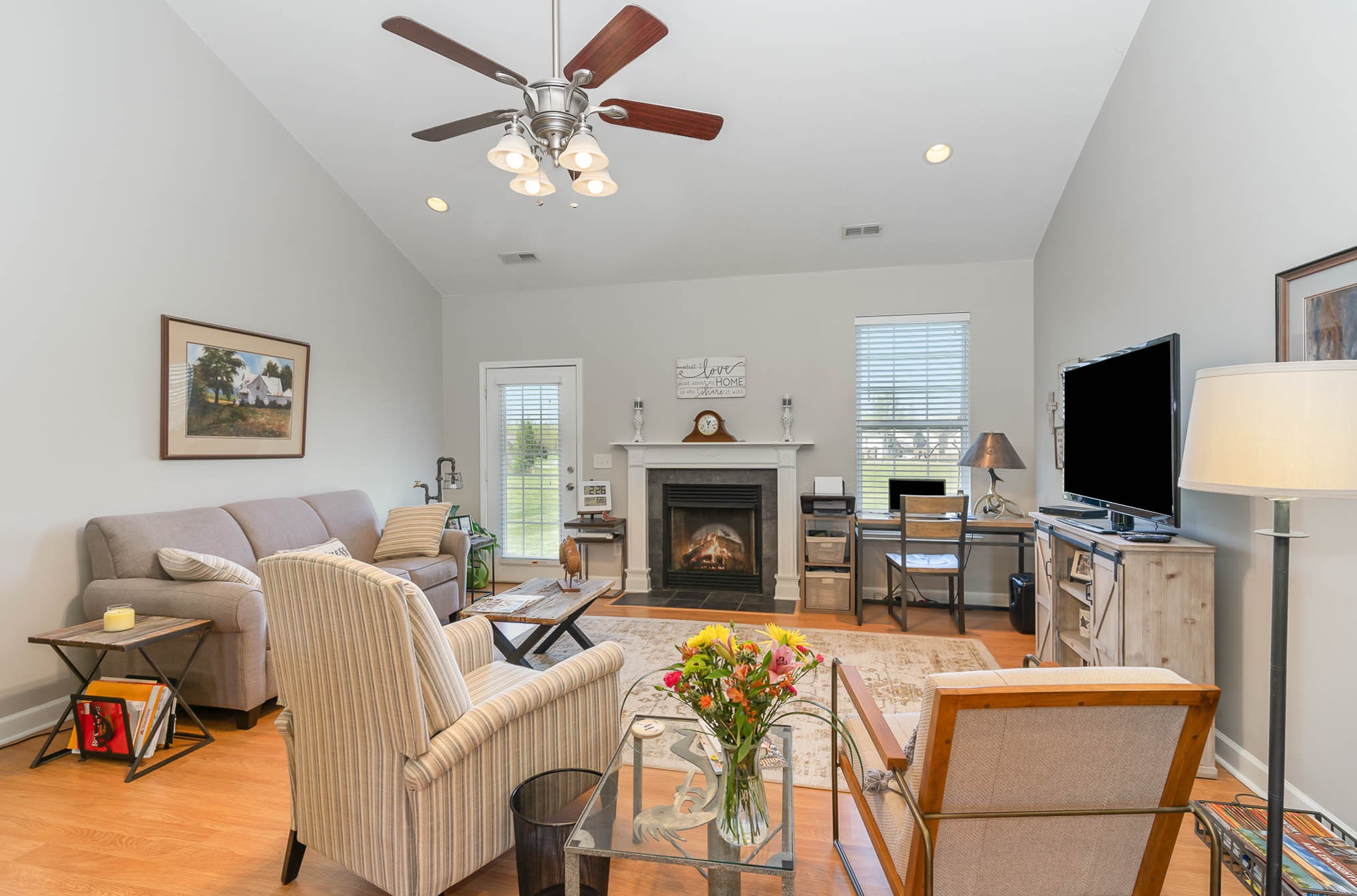 2010 Sunflower Drive Spring Hill, TN 37174 - Photo 2 of 20 a living room with furniture a fireplace and a flat screen tv