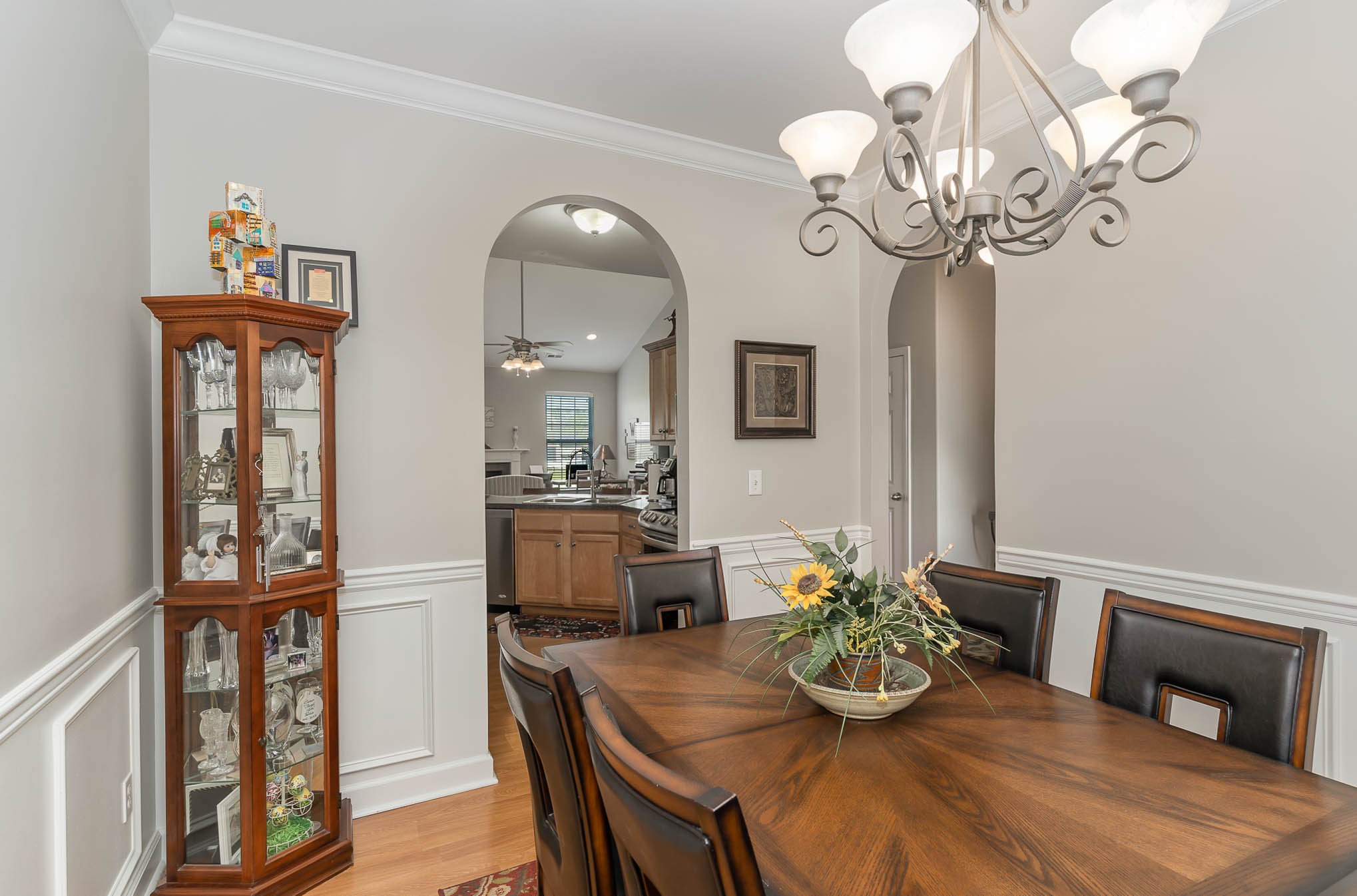 2010 Sunflower Drive Spring Hill, TN 37174 - Photo 7 of 20 a dining room with wooden floor a chandelier a wooden table and chairs