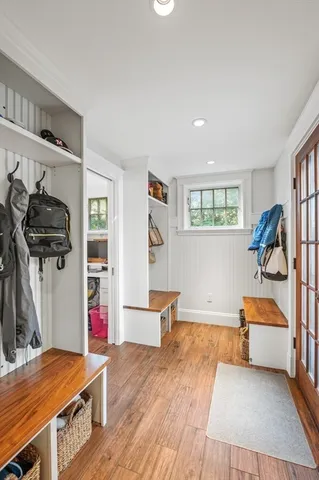 a bedroom with furniture and a wooden floor
